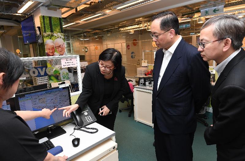 The The Secretary for Innovation and Technology, Mr Nicholas W Yang (second right), tours the 24-hour Call and Care Service Centre to learn about its round-the-clock services at the Senior Citizen Home Safety Association Jockey Club Oi Man Centre today (April 30).