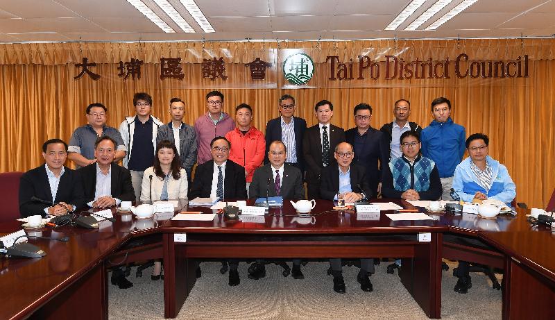 The Chief Secretary for Administration, Mr Matthew Cheung Kin-chung (front row, fourth right); the Secretary for Innovation and Technology, Mr Nicholas W Yang (front row, fourth left); and the Acting District Officer (Tai Po), Ms Iris Lee (front row, third left), in a group photo with members of the Tai Po District Council after meeting them during the visit to the District this afternoon (December 7).