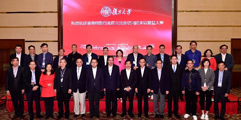 The Secretary for Constitutional and Mainland Affairs, Mr Patrick Nip (front row, sixth right), the Secretary for Innovation and Technology, Mr Nicholas W Yang (front row, fifth left), and the Secretary for Financial Services and the Treasury, Mr James Lau (front row, fourth left), and Legislative Council members line up for a group photo with the President of the Fudan University, Mr Xu Ningsheng (front row, seventh right), during their visit to the university today (April 21).