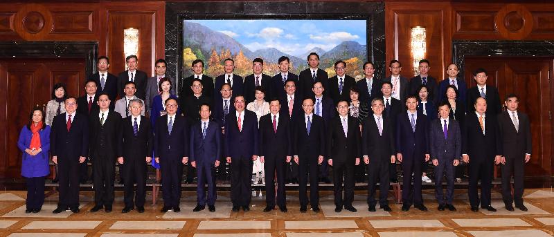 The Secretary for Constitutional and Mainland Affairs, Mr Patrick Nip (front row, seventh right); the Secretary for Innovation and Technology, Mr Nicholas W Yang (front row, fifth left); the Secretary for Financial Services and the Treasury, Mr James Lau (front row, fifth right), and the Legislative Council members at a group photo with the Mayor of Shanghai, Mr Ying Yong (front row, centre) on April 22 after their meeting.