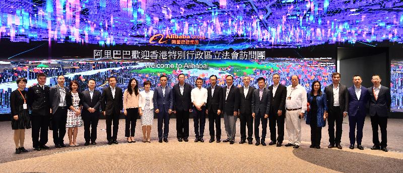 The Secretary for Constitutional and Mainland Affairs, Mr Patrick Nip (10th right); the Secretary for Innovation and Technology, Mr Nicholas W Yang (ninth right); the Secretary for Financial Services and the Treasury, Mr James Lau (eighth right); and Legislative Council members line up for a group photo with the Executive Chairman of the Alibaba Group, Mr Jack Ma (centre), at Alibaba's Hangzhou headquarters today (April 24) during the Legislative Council joint-panel duty visit to the major cities in the Yangtze River Delta Region.